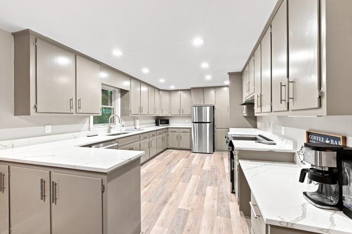 Restored kitchen cabinets with quartz countertops